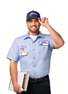 Roto-Rooter technician tipping hat holding clipboard